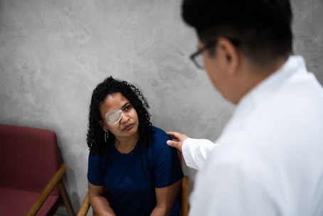 woman with eye patch at the doctor