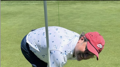 Brett playing in a golf fund raiser for Ronald McDonald House. Brett hit a hole in one with an Air Gun . Photo